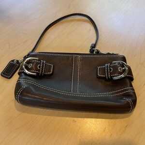 Coach Wristlet Brown Leather. Silverside buckles. 6 1/2” x 4”